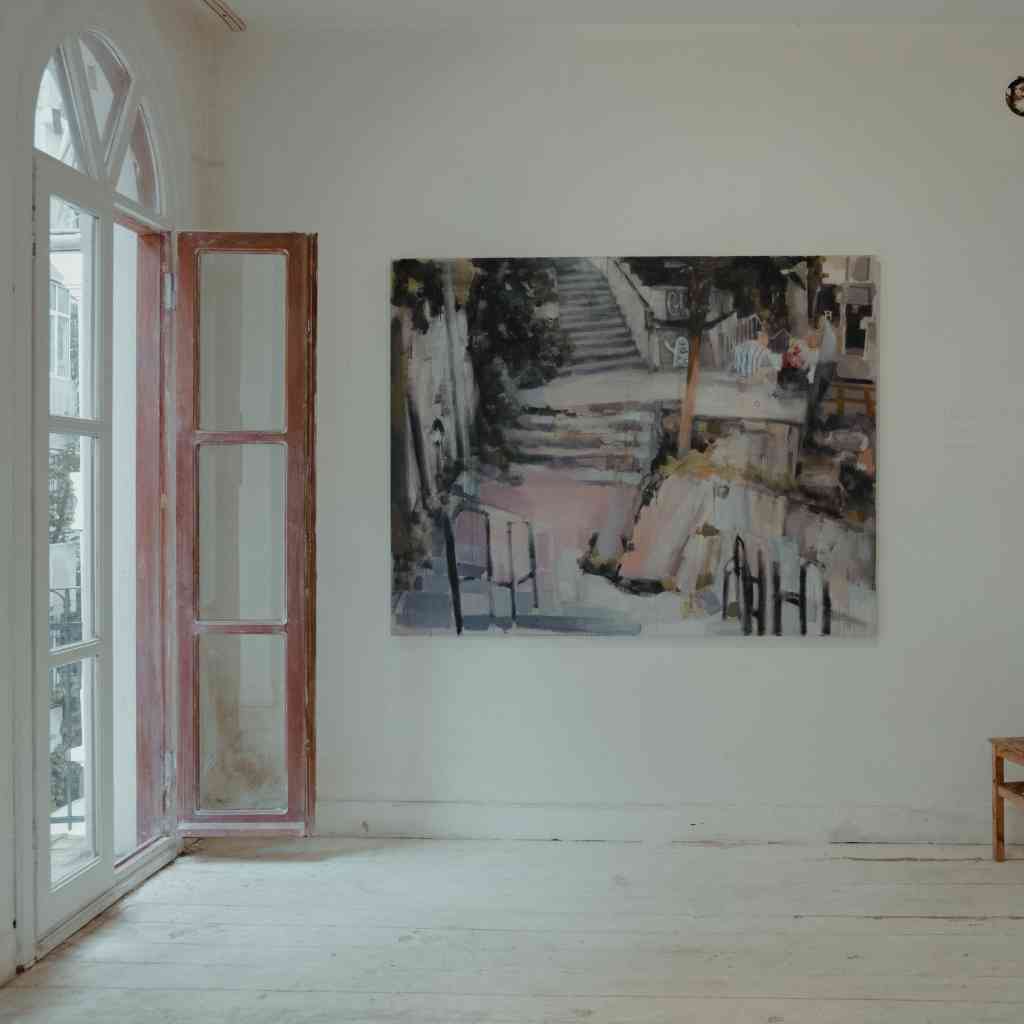 A single large painting or photograph can become the focal point of a room