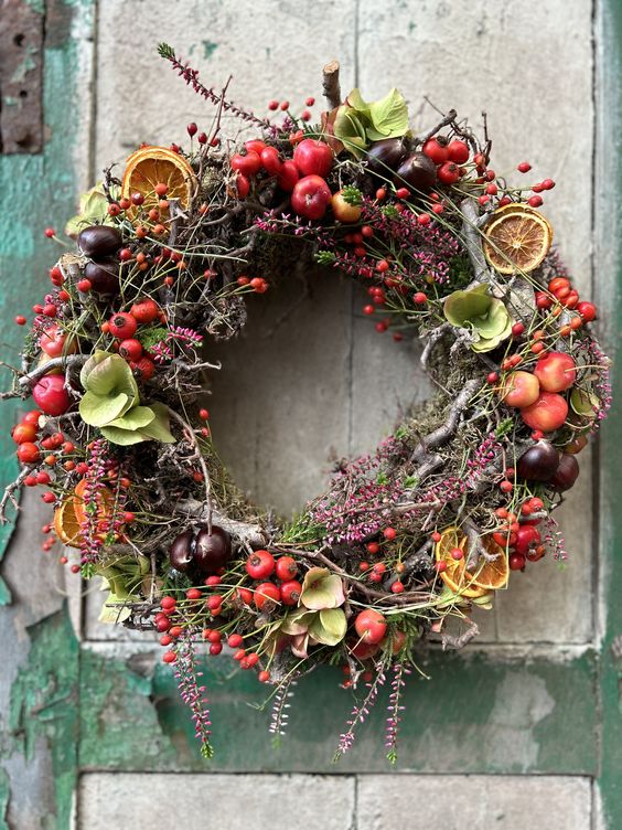 a handmade wreath made of dried flowers, berries, or twigs on your front door 