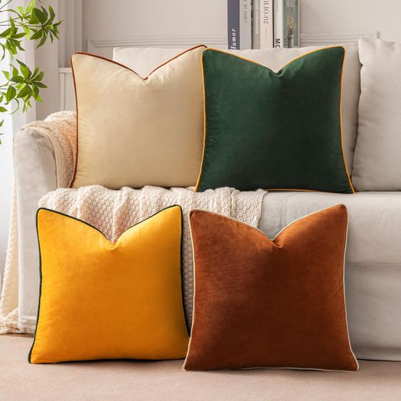 Mixing textures like velvet pillows with linen