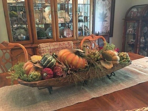 A beautiful fall centerpiece can also be made by grouping these items together in a rustic wooden bowl or basket.